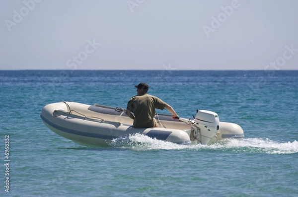 Fototapeta rubber dinghy with captain