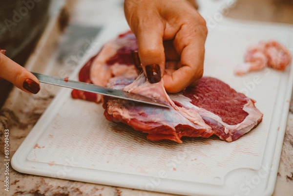 Fototapeta Fat from red meat is removed by the cook. Red meat has a huge amount of vitamins from complex B, E, K and zinc, iron, proteins.