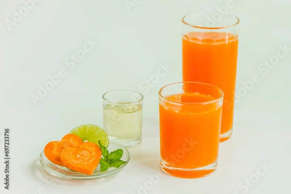 Fototapeta Carrot lemon juice and syrup for healthy drinking
