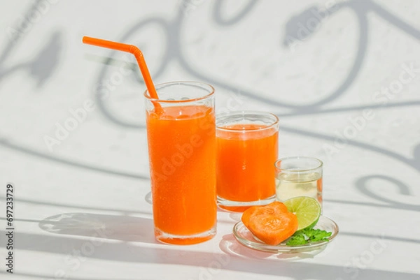 Fototapeta A glass of healthy carrot juice with ingredients