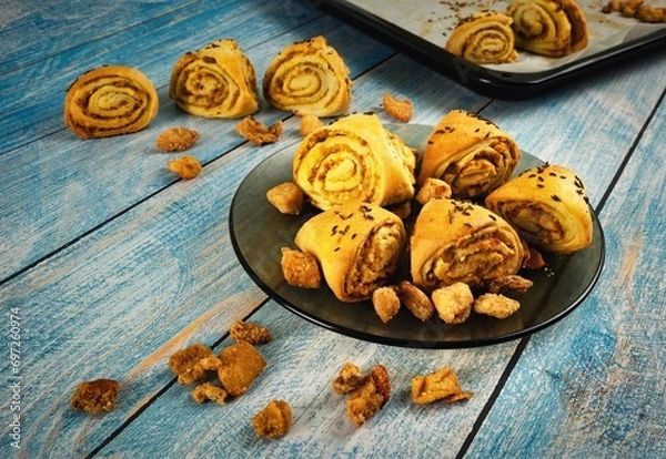 Fototapeta Cracked snails with sourdough on a blue table