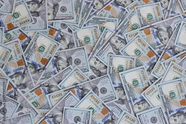 Fototapeta Very big amount of US hundred dollar bills close up. Huge quantity of united states currency notes on flat table