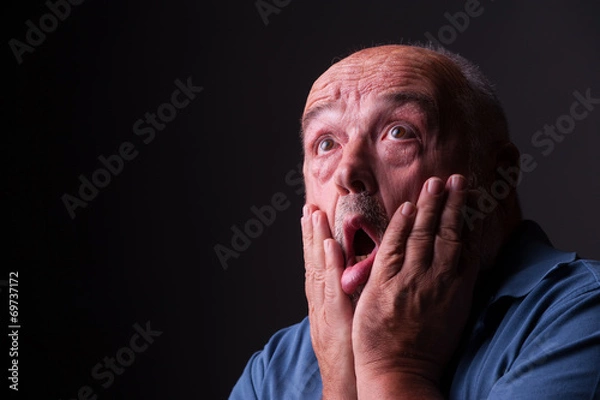 Obraz old man looking scared or crazy