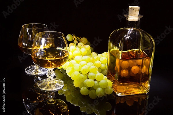 Obraz Bottle of brandy and two glasses and grapes