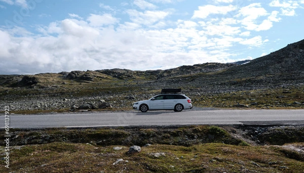 Obraz car with rooftop tent on the road
