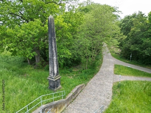 Fototapeta Obelisk on the long-distance cycle path in Dessau on the Elbe embankment