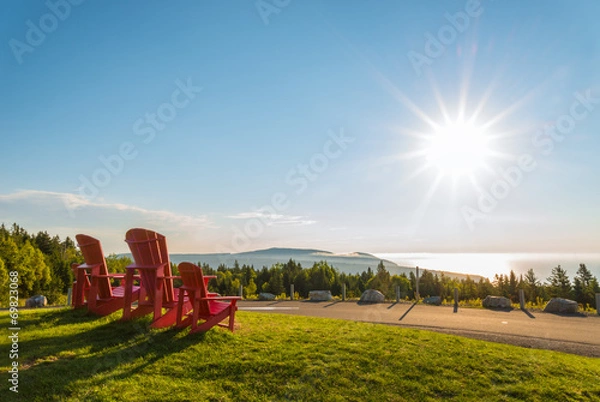 Fototapeta Red chairs from Butland lookoff  with a beautiful view of Fundy