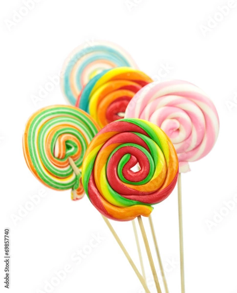 Fototapeta Colorful spiral lollipops on white background