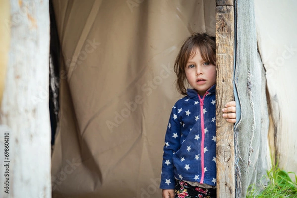 Fototapeta Syrian refugee children suffer from tragic humanitarian conditions in the winter.