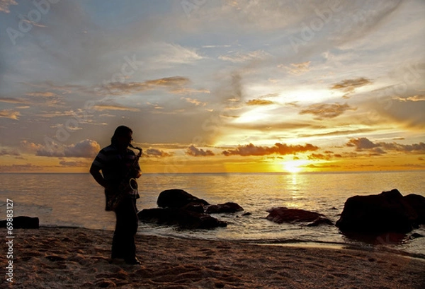Obraz Sillhouette of a saxophonist at beach