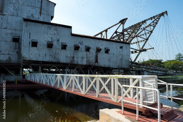 Fototapeta The last abandoned tin mining dredger during British colonial now display in Tanjung Tualang, Batu Gajah, Perak, Malaysia