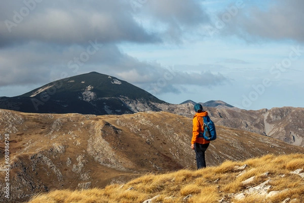 Obraz Explorers trek through rugged terrain.