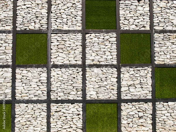 Obraz Artificial grass  and stone wall as background