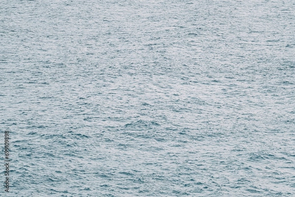 Fototapeta Blue green surface of the ocean on Canary Islands in Spain with gentle ripples on the surface and light refracting