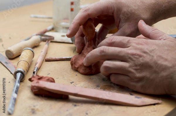 Obraz Main d'homme modelant