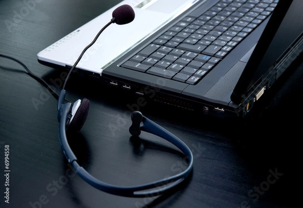 Obraz Laptop computer and headphone with microphone