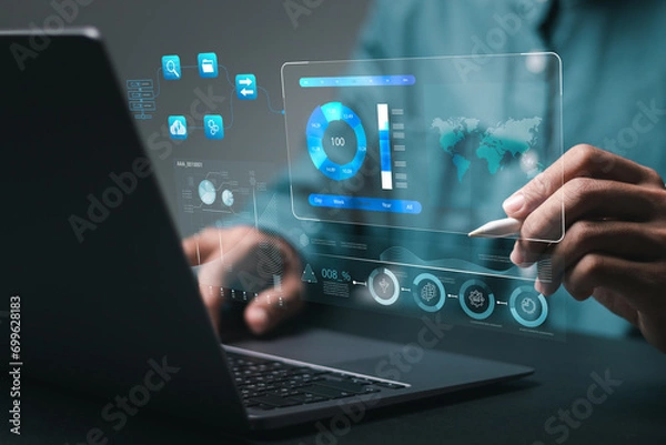 Fototapeta Businessman using analytics data KPI technology and data management system. Corporate strategy for finance, operations, sales, marketing.