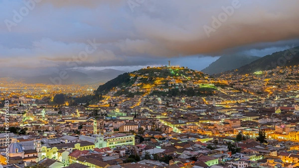 Fototapeta Panecillo hill Virgen of Quito statue and old colonial center of Quito at blue hour