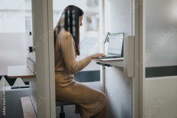 Obraz Businessperson analyzing, discussing solutions, and making a video meeting call for a successful project.