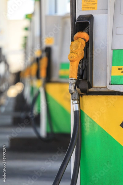 Fototapeta Nozzle of fuel pump on petrol station.