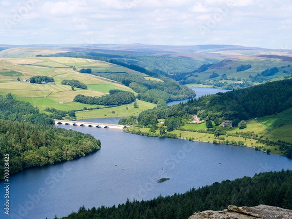 Obraz Beautiful view of Ladybower Reservoir or lake in between vibrant hills in Peak District National Park, Derbyshire, England. Seven arch bridge viaduct across the lake ads nice detail in the scenery.