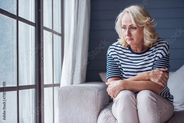 Obraz Sad senior woman