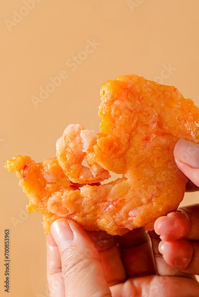 Obraz Shrimp steaks, snack made with shrimps and vegetables, children's food fried, golden and pink meat texture, closeup on tabletop indoors