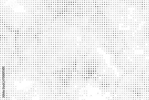 Fototapeta pattern with dots, a black and white dotted background with white dots,  grunge dot effect