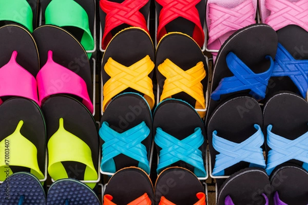 Fototapeta Colorful of flat shoes hanging on shelf for sale.