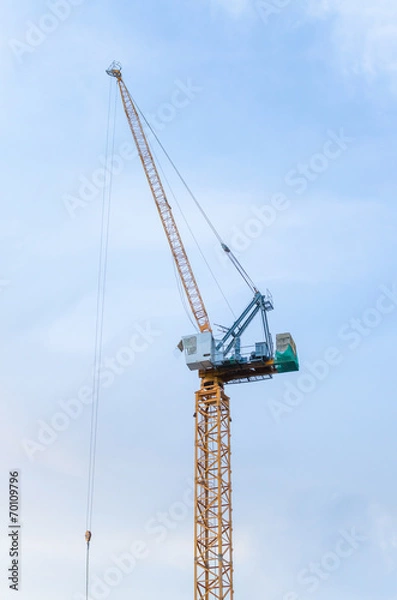 Obraz Yellow crane in a construction site