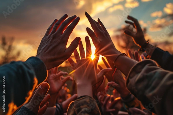 Fototapeta Powerful image capturing diverse hands reaching together towards the sunset, symbolizing unity diversity and collective hope. Ai genrated