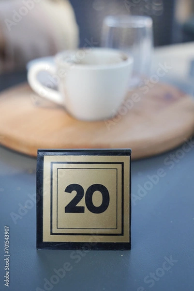 Fototapeta 14 number sign number on cafe table .