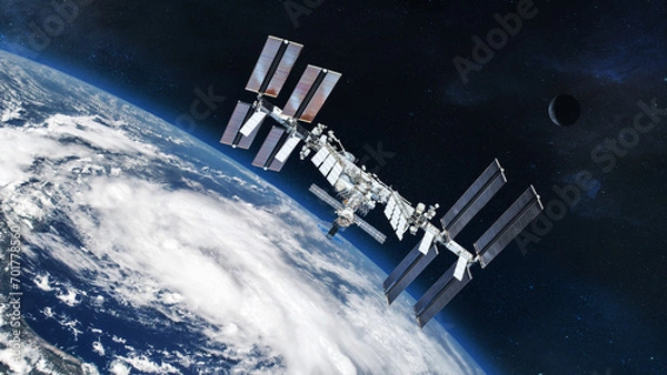 Fototapeta ISS with solar panel discovery Earth atmosphere. Element of this image furnished by NASA.