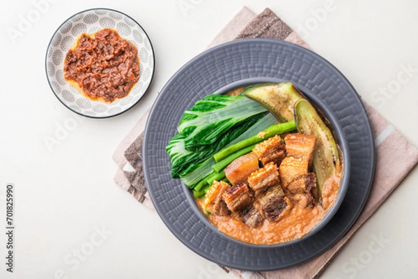 Fototapeta Crispy Pork Kare Kare (Peanut Sauce) with Vegetables and Shrimp Paste on the side 

