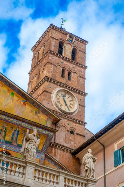 Fototapeta Rome, Italy - February 21, 2023: Clocktower of the Basilica of Santa Maria in Trastevere, Rome, Italy