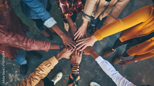 Fototapeta A diverse group of people holding hands, forming a colorful circle that represents unity and acceptance