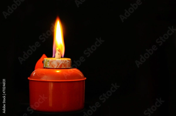 Obraz Litted Oil Lamp - Pelita in its original ambient lighting at nig