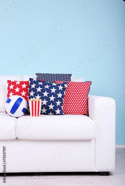 Fototapeta Popcorn and ball on sofa in room