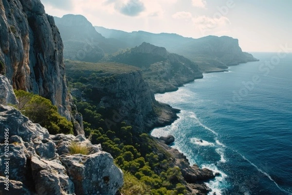 Fototapeta A breathtaking view of the ocean from the top of a majestic mountain. Perfect for travel and nature themes