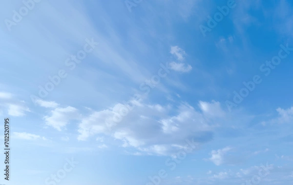 Obraz Blue sky with some clouds. View over the clouds light background. 