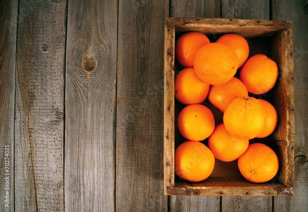 Fototapeta Oranges in a box