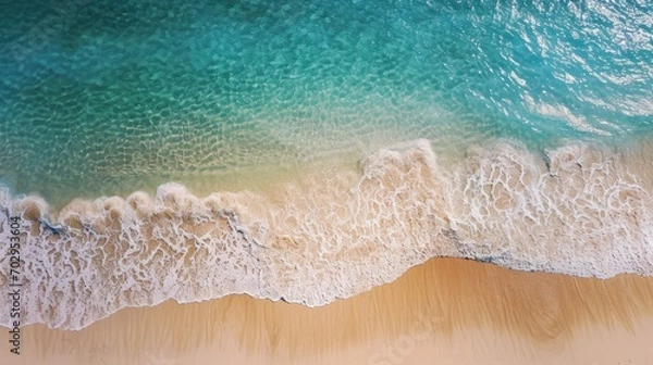 Fototapeta Beautiful sandy beach and soft blue ocean wave from top view , Summer seascape background.
