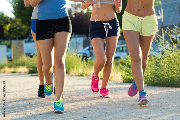 Obraz Group of women running in the park.