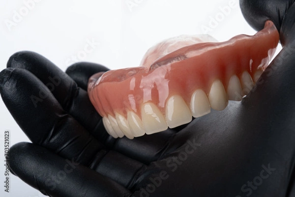 Obraz Upper complete denture on hand.