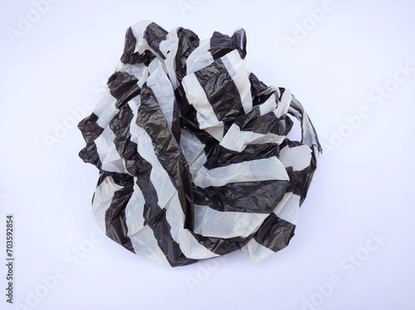 Fototapeta Black and white striped plastic bag isolated on white background