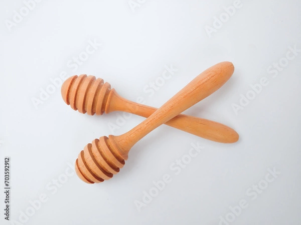 Fototapeta Wooden honey spoon isolated on white background