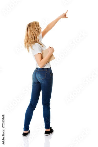 Obraz Student woman showing copyspace