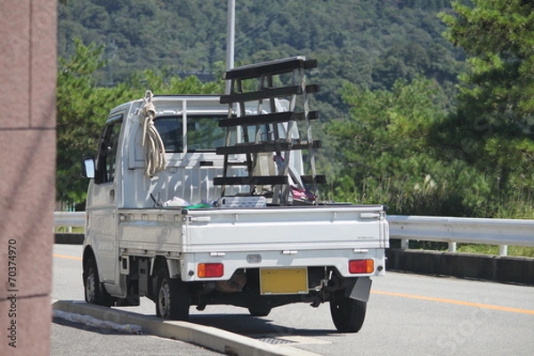 Fototapeta ガラス屋さんの軽トラック