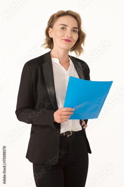 Fototapeta Business woman in a jacket with a folder in hands