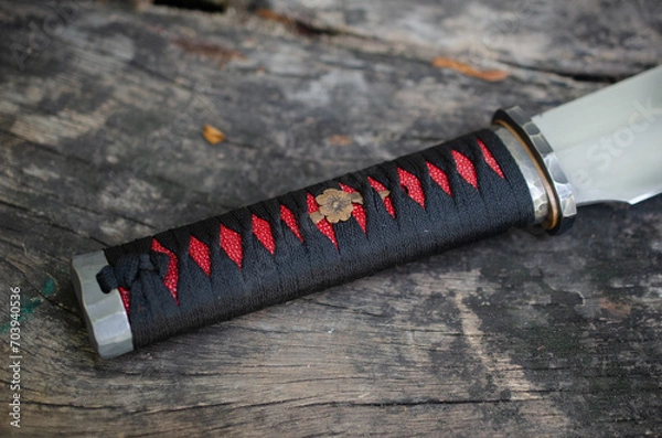 Fototapeta Red and black colure with tanto knife handle wraping
